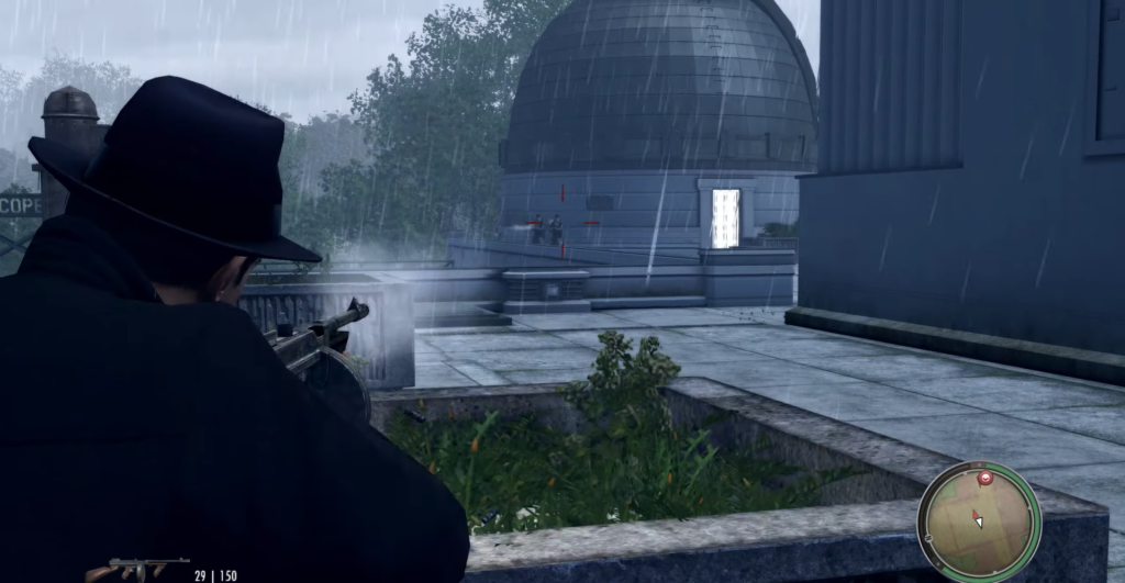 Man aiming rifle under heavy rain.