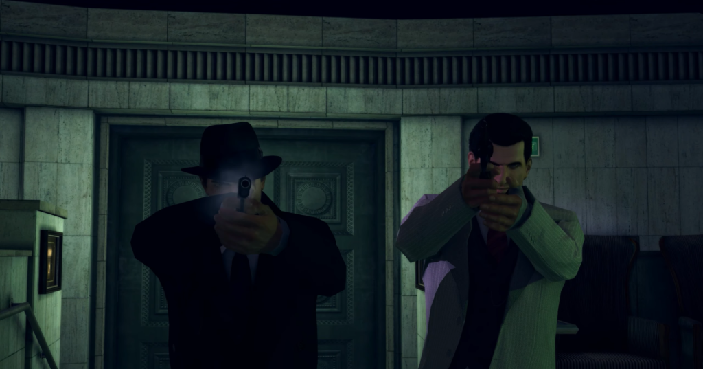 Two men aiming guns indoors.