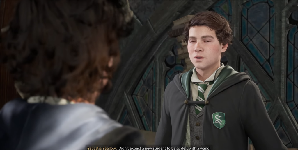 Sebastian Sallow speaks in Hogwarts attire.