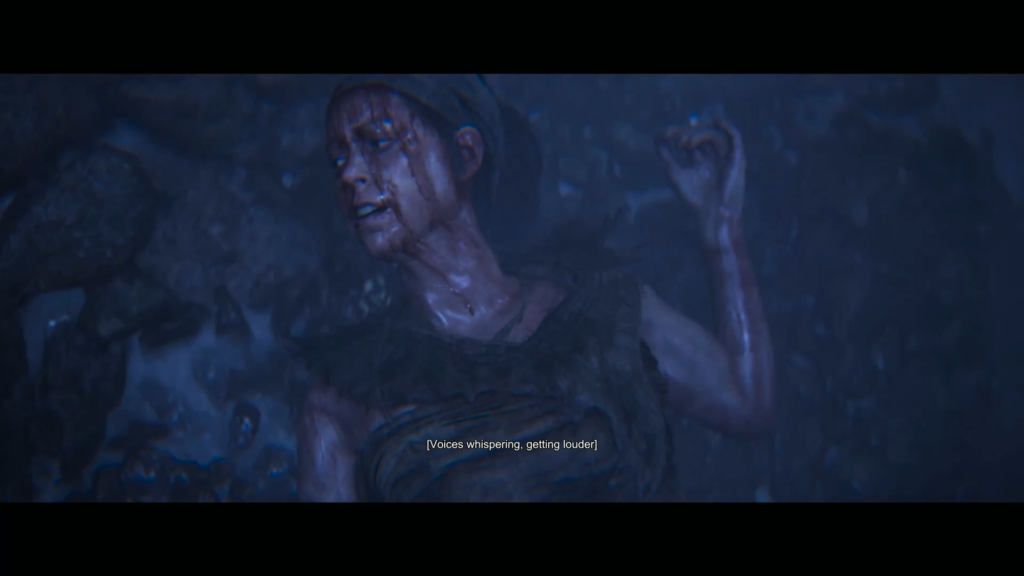 Woman lying injured on rocky ground in rain