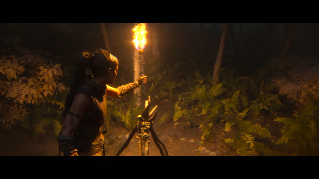 Lara Croft holds torch in dark forest campfire area