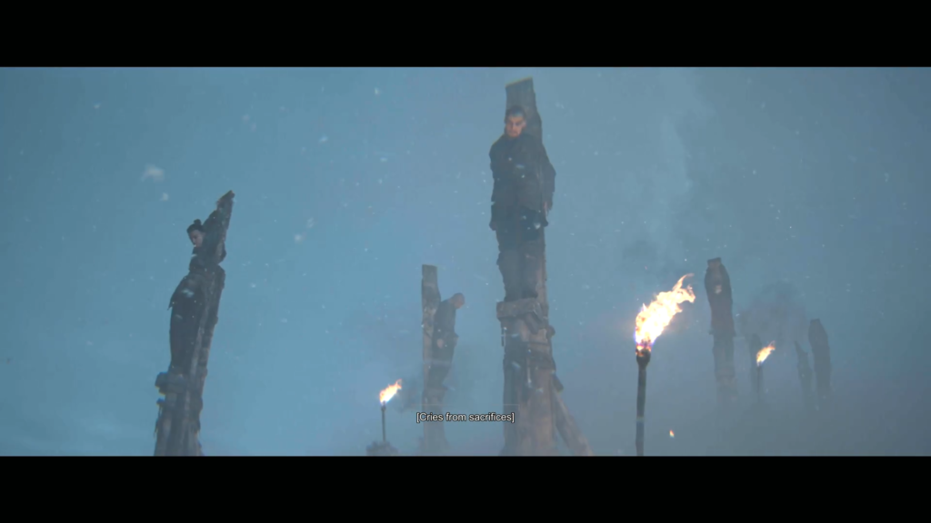 People tied to wooden stakes in snowy foggy field