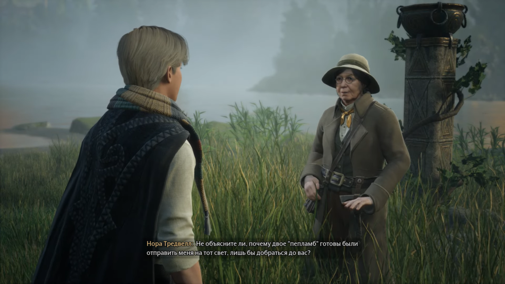 Two people talking in grassy lakeside area