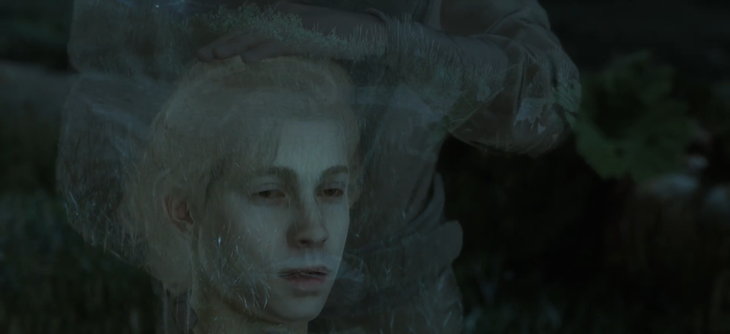 Blond person lying on grass at night