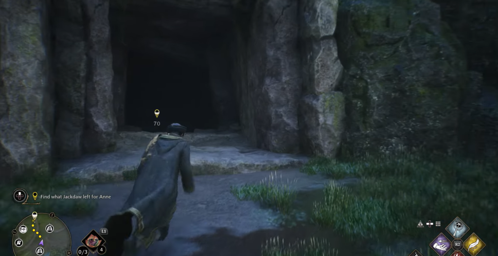Hogwarts Legacy player runs toward dark cave entrance