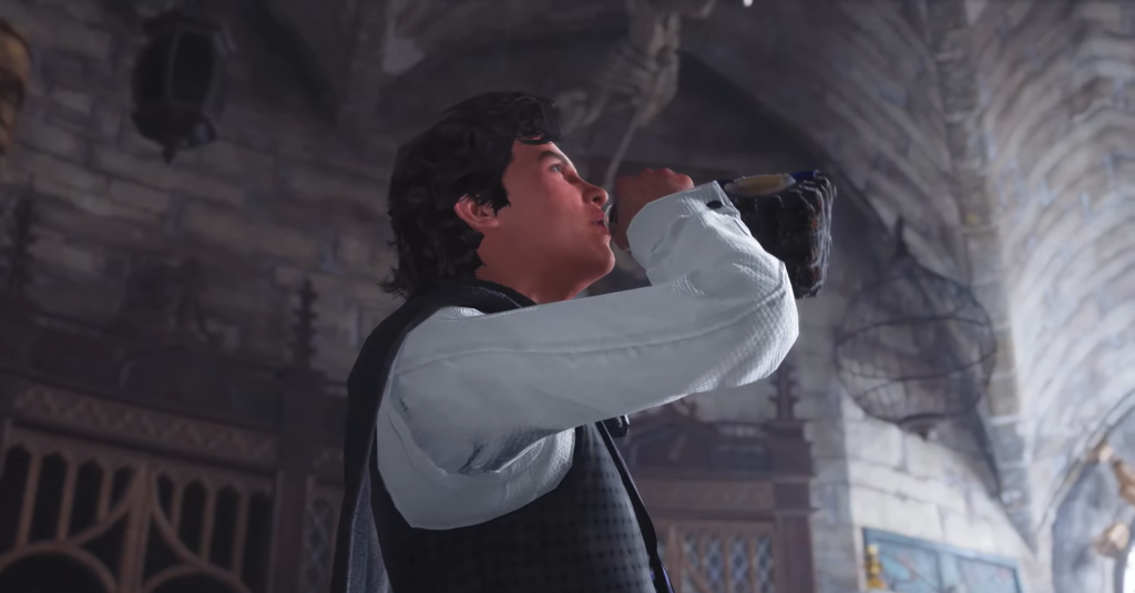 Мужчина пьет из бутылки в каменном зале