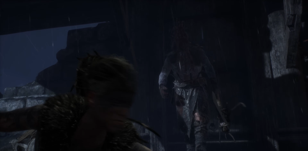 Воин идет под дождем среди каменных руин