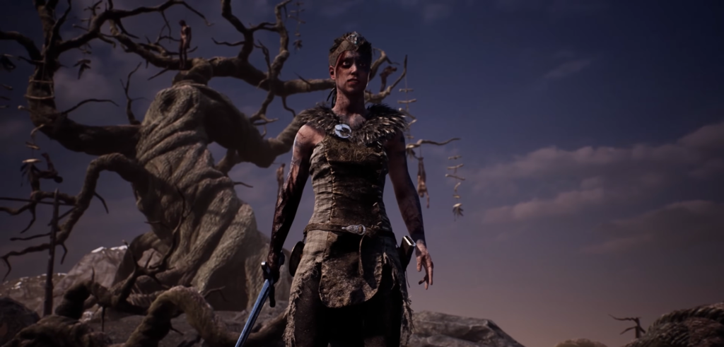 Сенуа из Hellblade стоит у мёртвого дерева