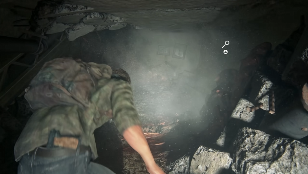 Joel crawling through rubble in The Last of Us