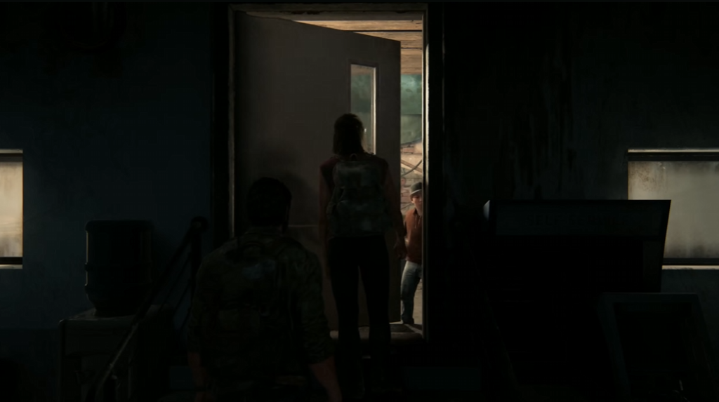 Woman opening door as man crouches inside room