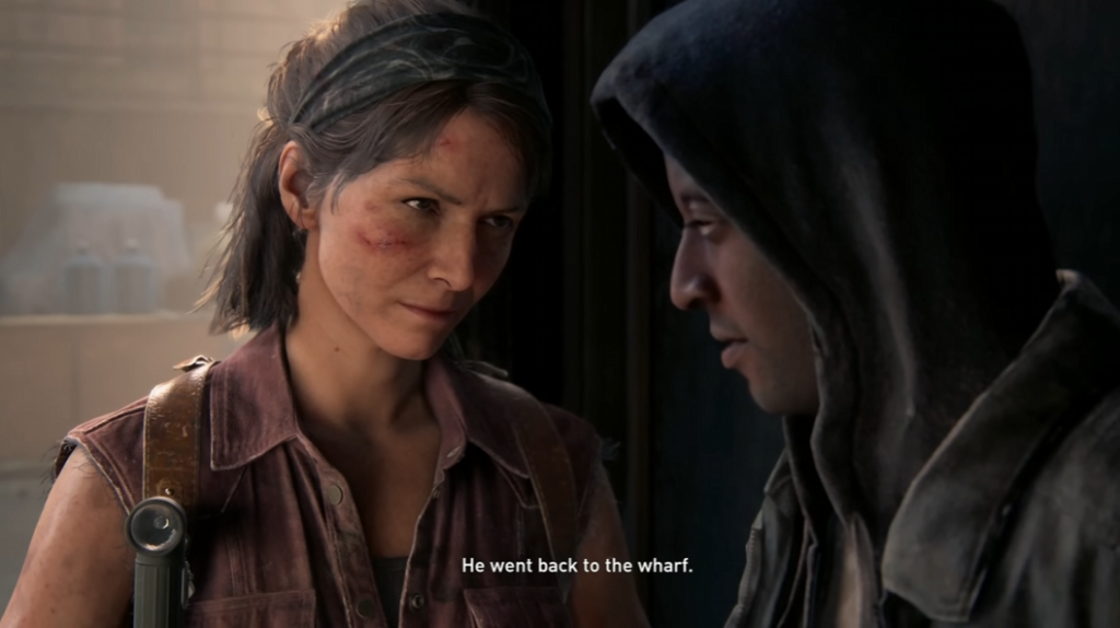 Woman faces hooded man indoors