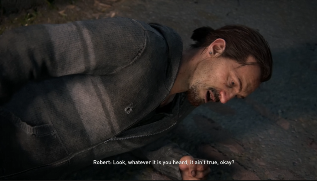 Man lying on ground with hands behind back