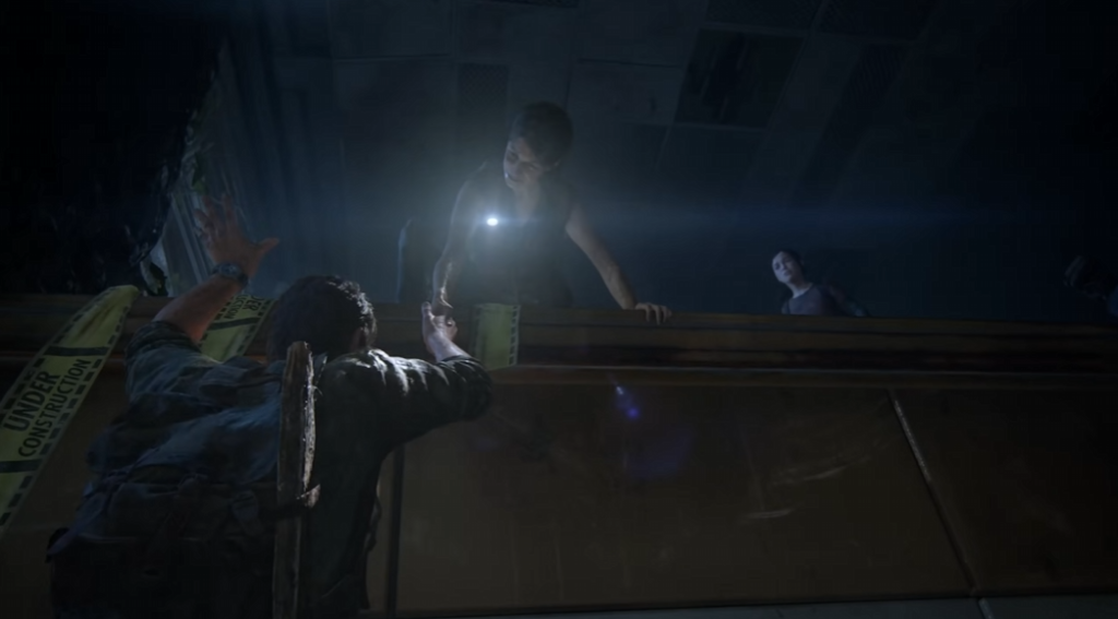Joel climbs ledge toward Tess in The Last of Us