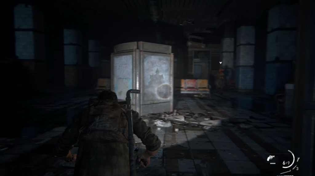 Player crouches in dark subway station corridor