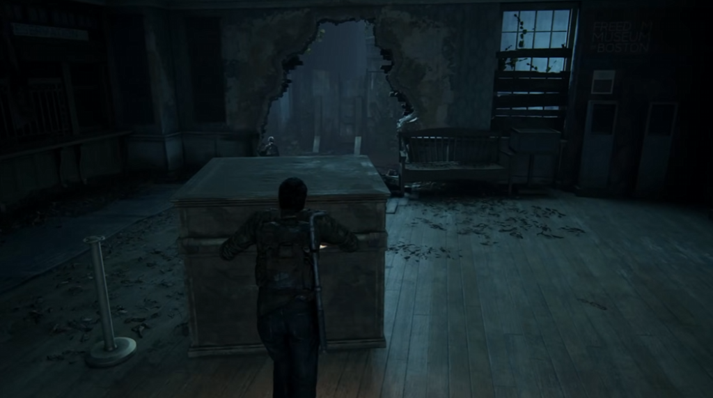 Joel pushes crate inside ruined museum in The Last of Us