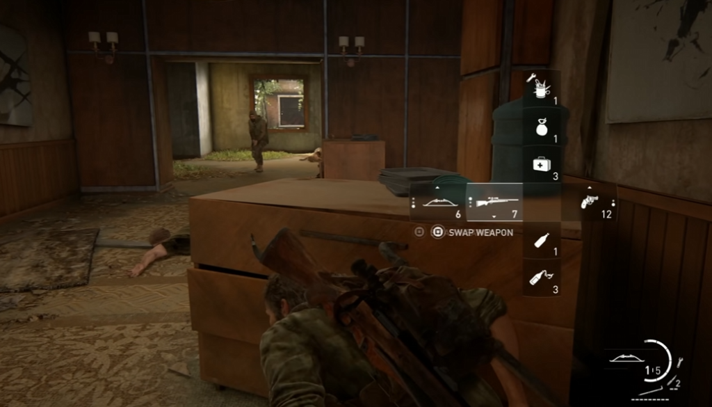 The Last of Us Ellie crouches behind desk indoors