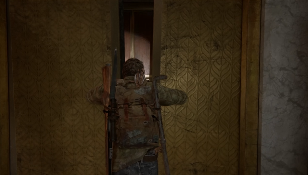 Joel opening elevator doors in The Last of Us