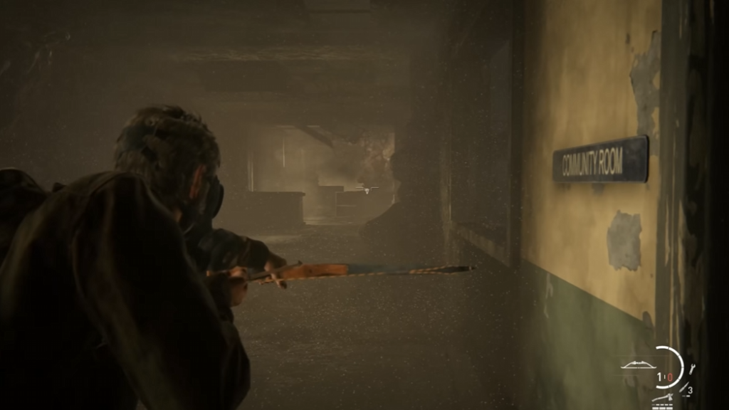 Person aiming rifle in hallway near community room sign