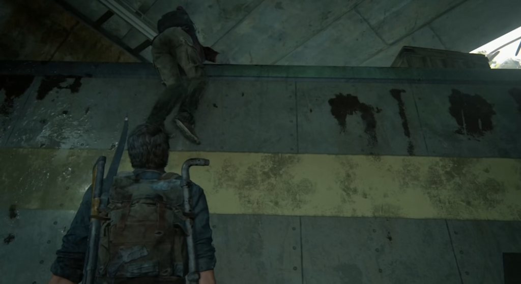 Joel climbs wall behind ally in The Last of Us