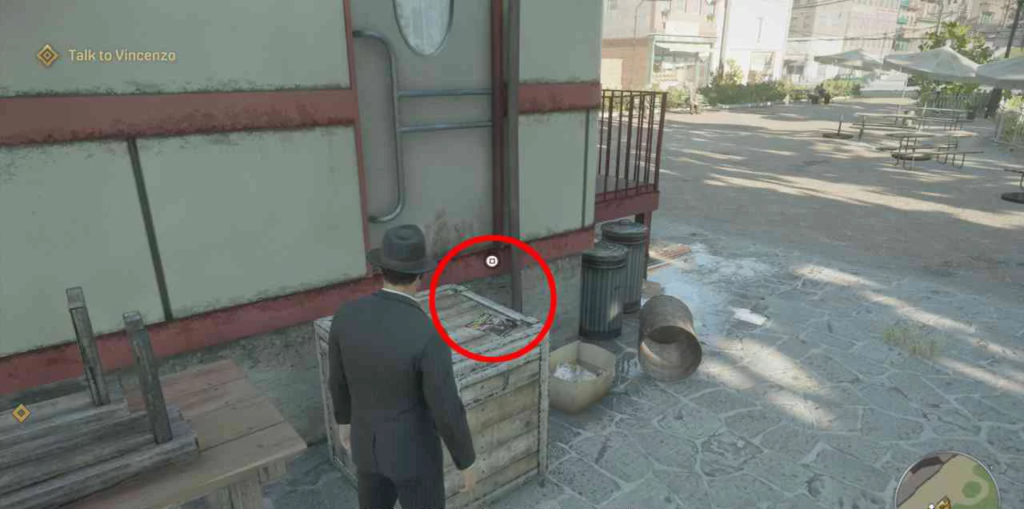 Mafia: Definitive Edition character opening crate in courtyard