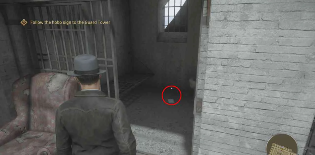 Detective in hat enters jail cell corridor in game