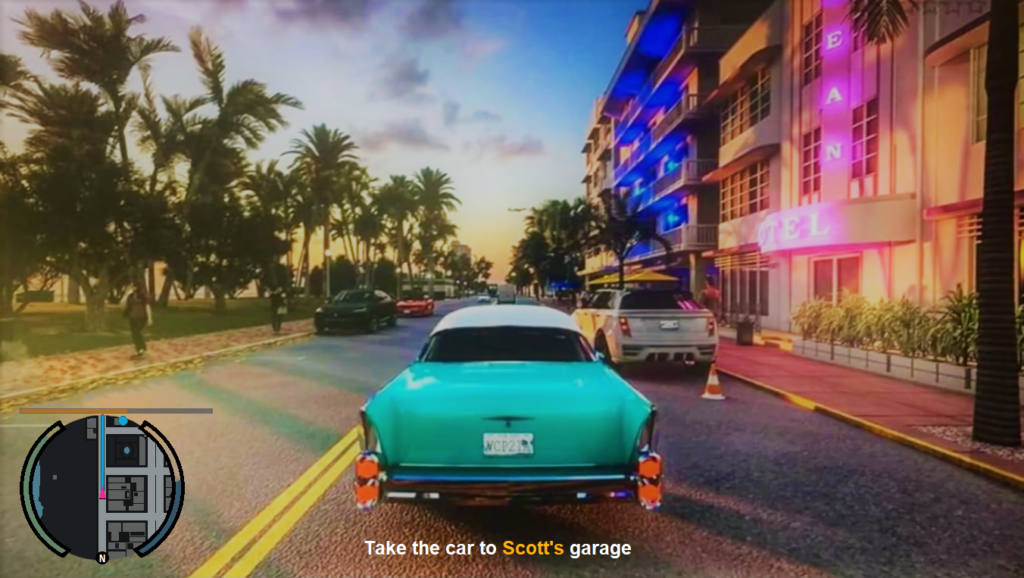 Car driving past neon hotel on palm-lined street