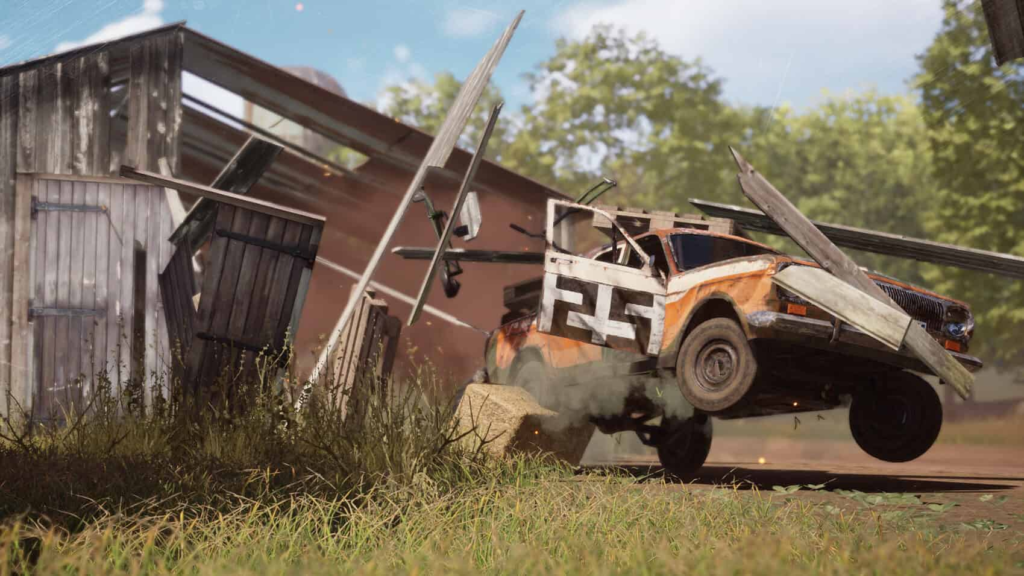 Orange race car crashes through wooden barn wall