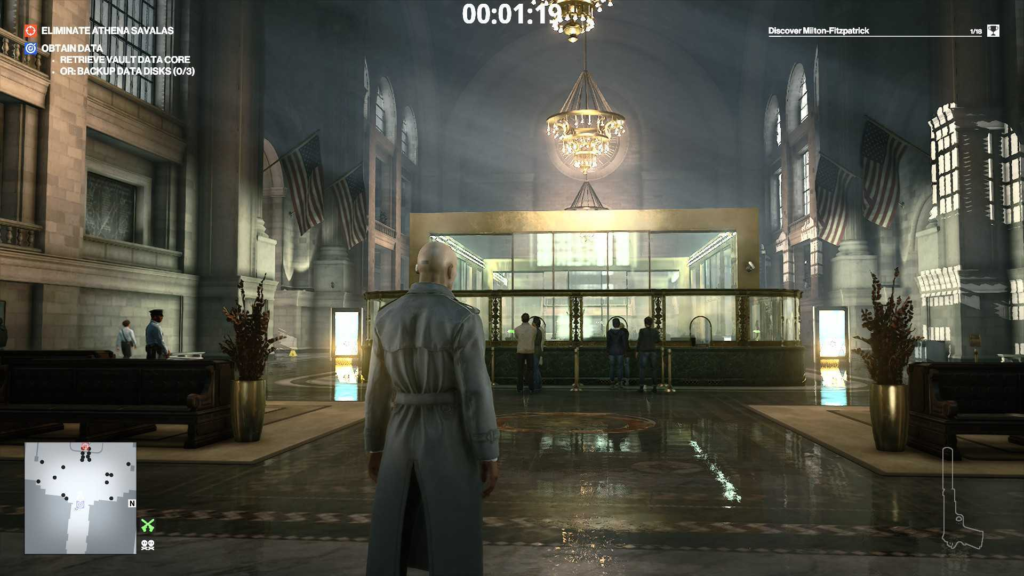 Agent 47 in Hitman stands in bank lobby