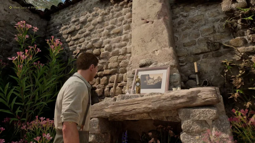 Indiana Jones examines framed photo on stone wall altar