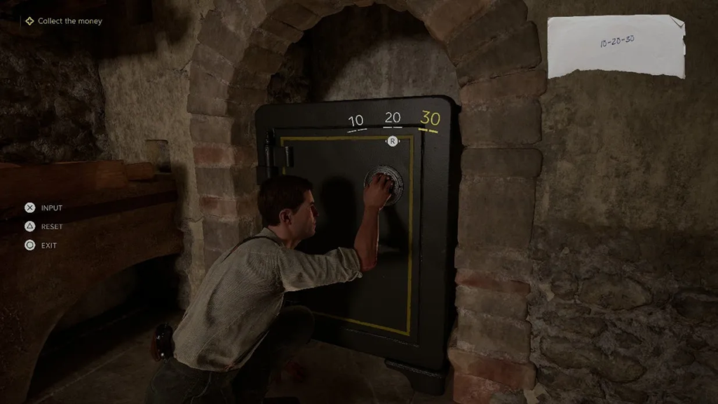 Uncharted 4 Nathan Drake opening safe in stone alcove