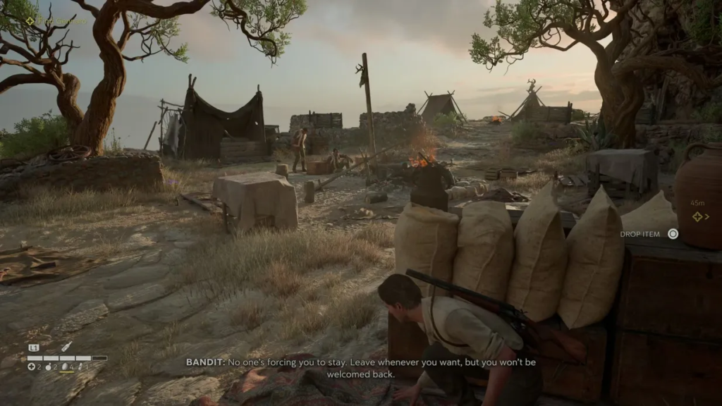 Sniper Elite 5 soldier crouching behind sandbags in camp
