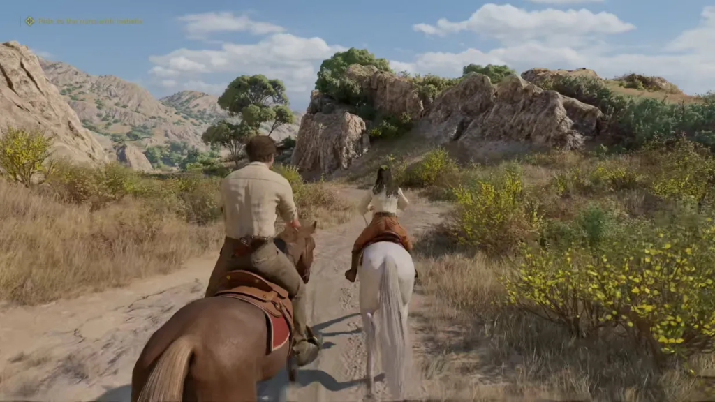 Two riders on horses along rocky dirt trail