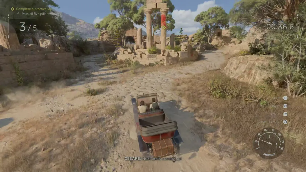 Car driving on dirt road through ruins in Uncharted 4