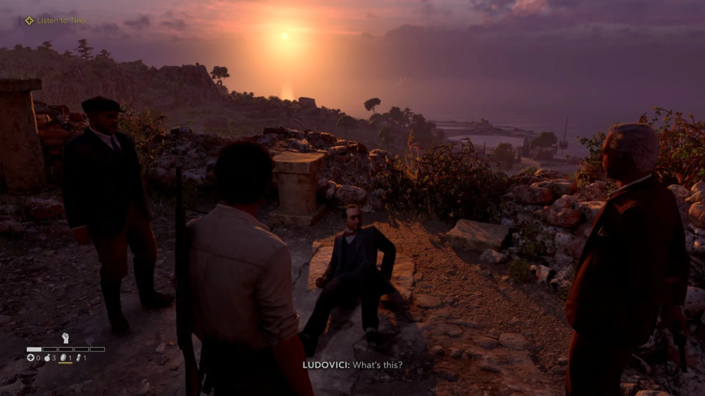 Men talking beside seated man at sunset overlook