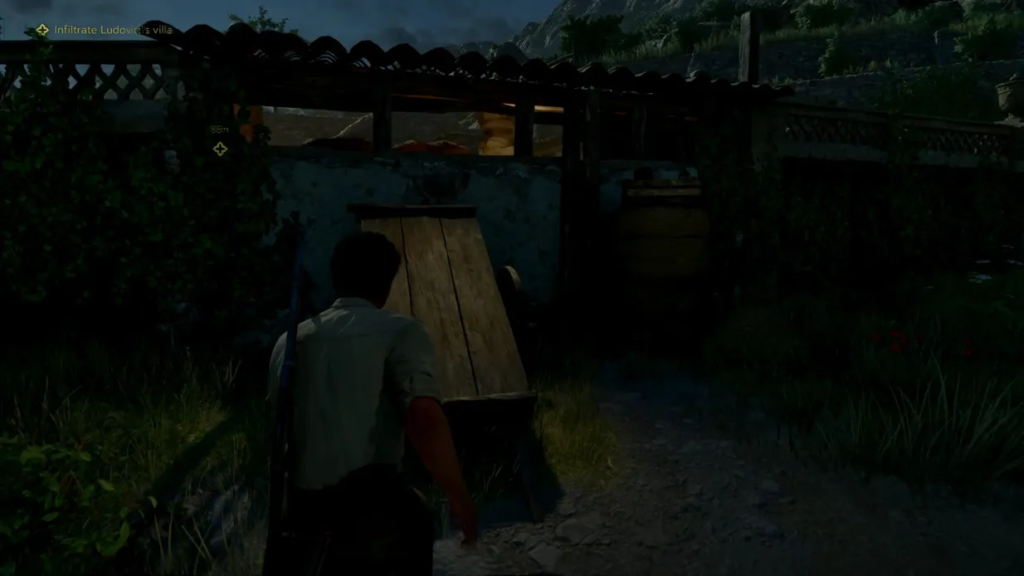 Player character sneaks toward villa entrance at night