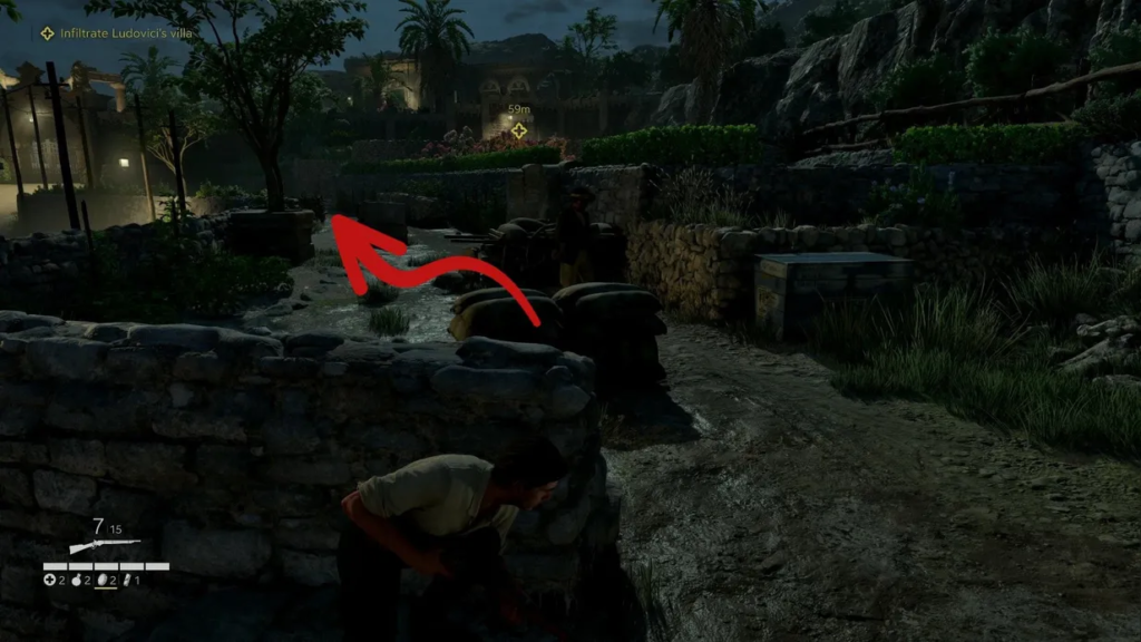 Sniper Elite 5 player crouching behind stone wall at night