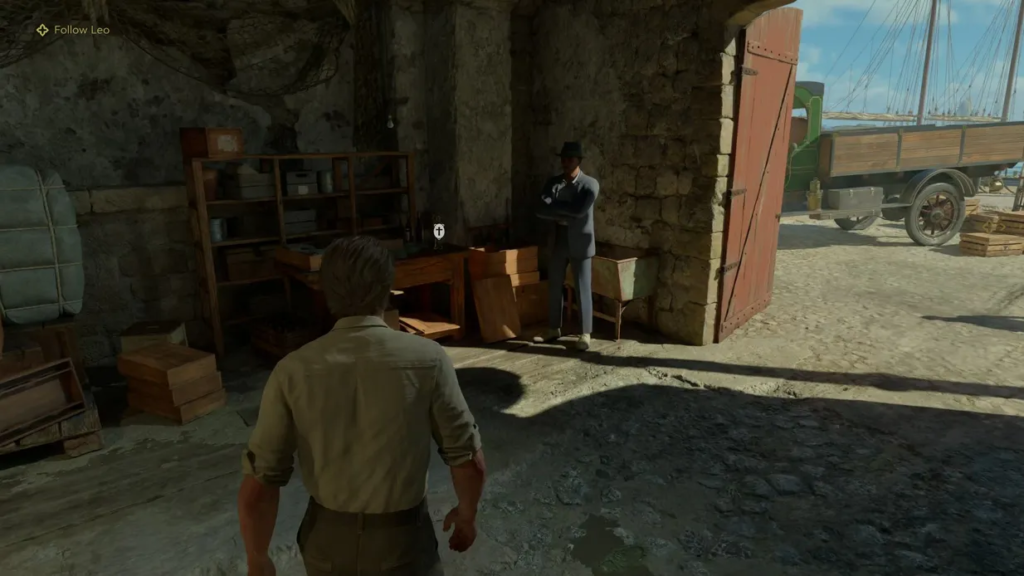 Man approaching suited man in stone warehouse doorway