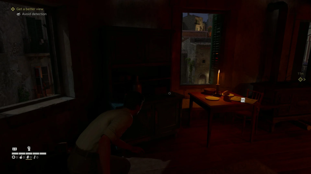 Player crouches in dark room beside candlelit table