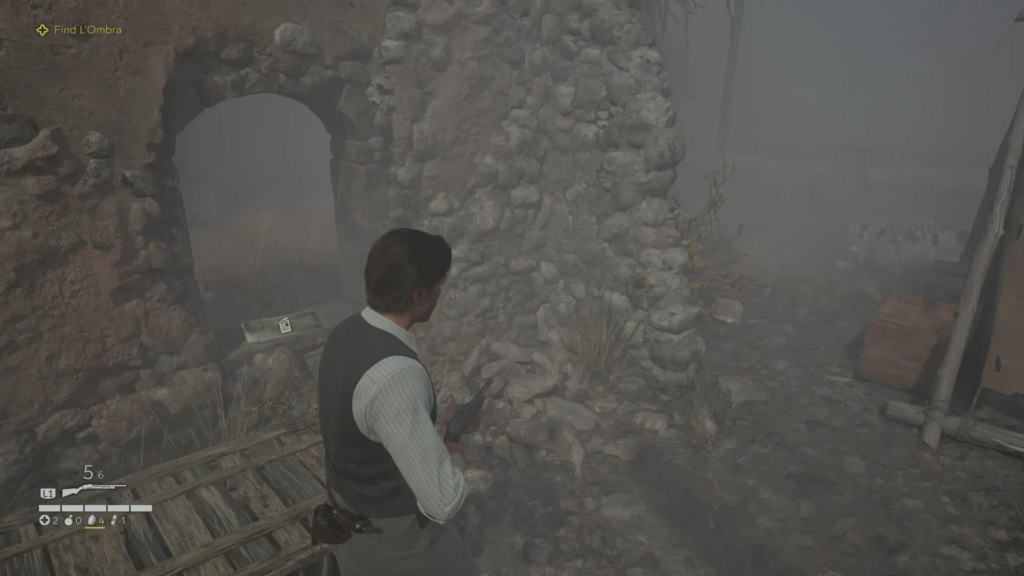 Man holding gun near stone ruins in fog