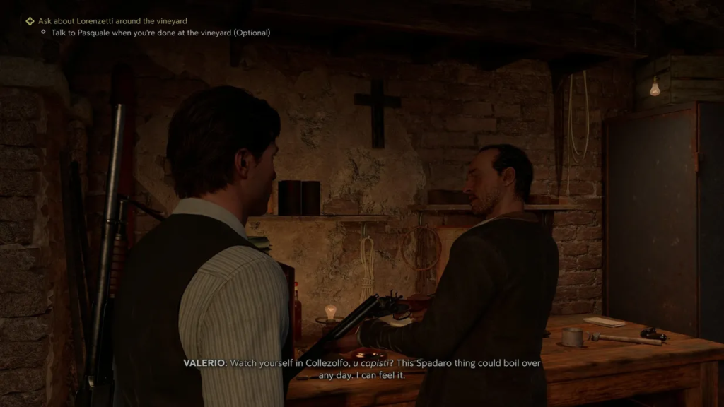 Two men talk in rustic workshop with guns