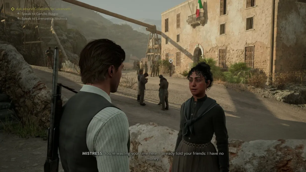 Man talking to woman outside stone building courtyard