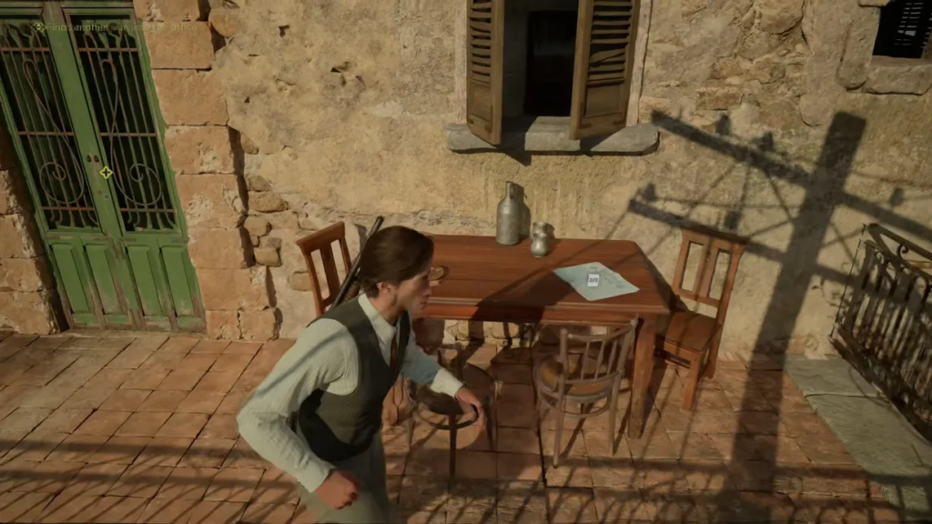 Man walking past table on stone patio