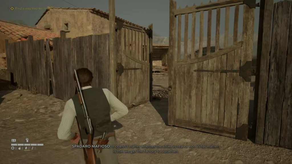 Man carrying rifle walks through wooden gate courtyard