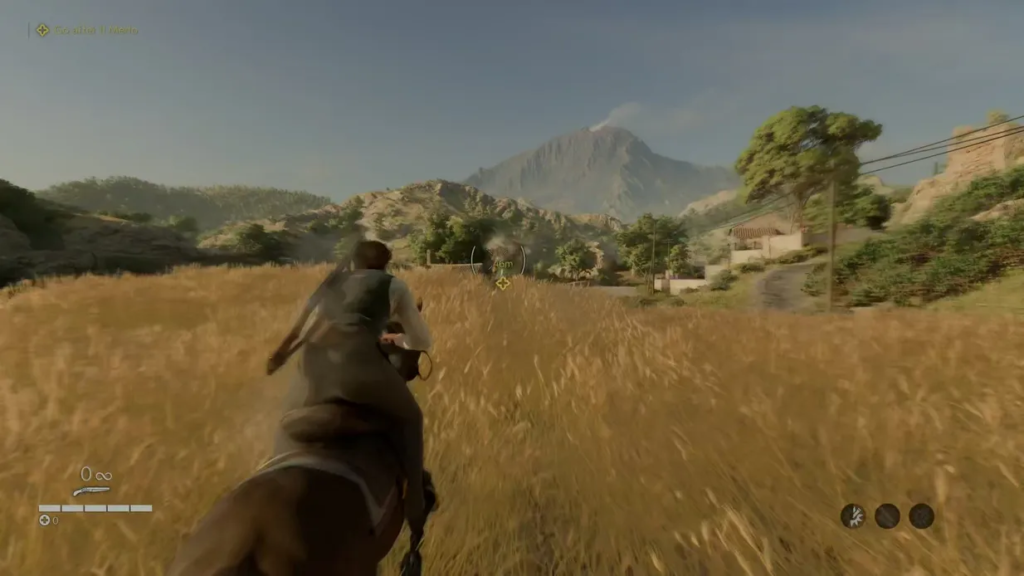 Rider gallops horse through grassy field toward mountains