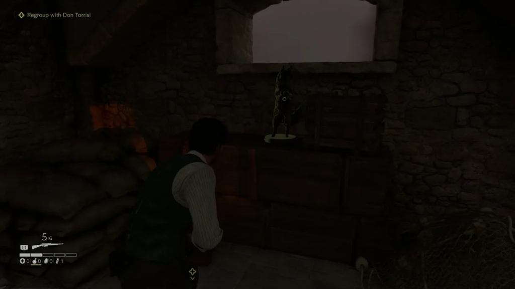 Player aiming at statue inside stone room in Mafia III