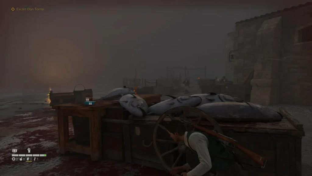 Karl Fairburne crouching behind fish cart in foggy dockyard