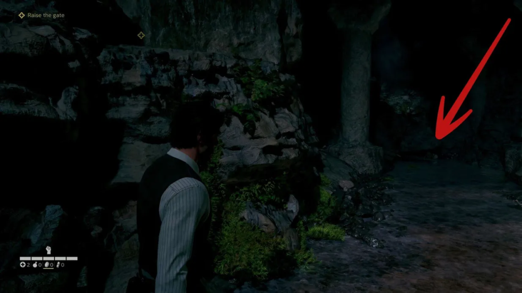Man standing in rocky cave corridor near pillar