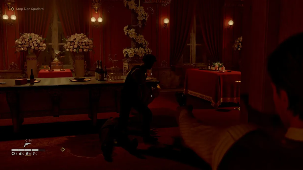 Player aims pistol at man in red dining room