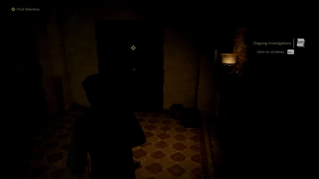 Player character walks through dark hallway in game