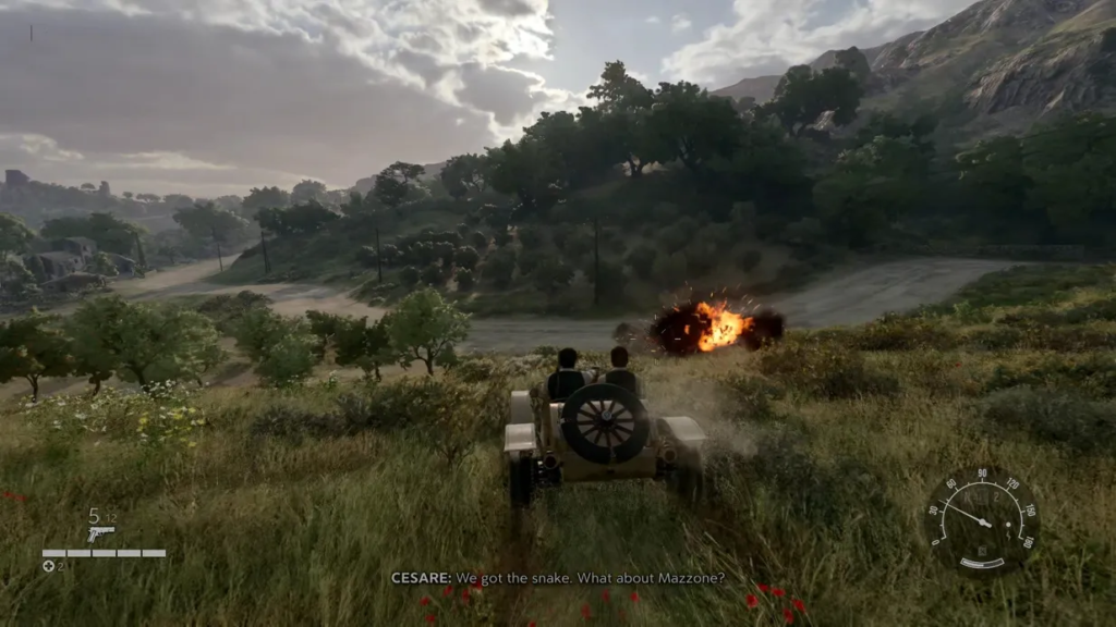 Car driving through grassy hills toward fiery explosion